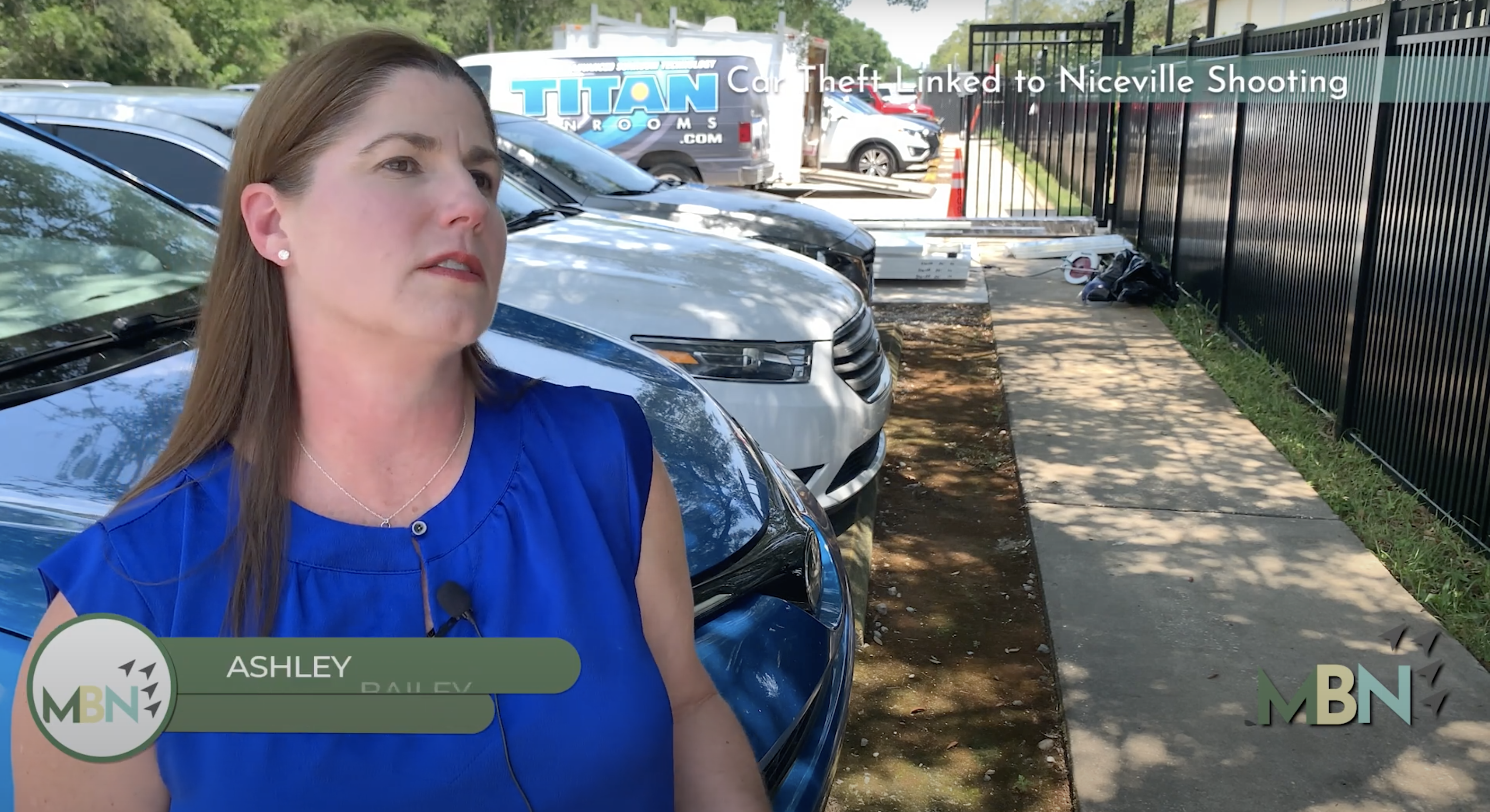 Woman Talking in Front of Cars