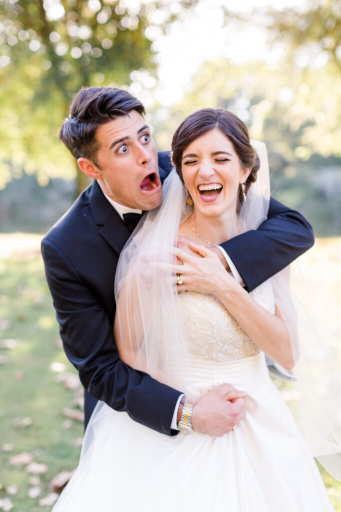 Man and woman goofing around in wedding photos