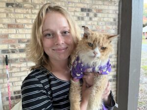 woman holding a cat
