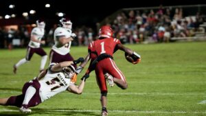 Peyton Holloway attempts to bring down Patrick Rodgers. In the Niceville versus Crestview contest that was held in Crestview on September 13.