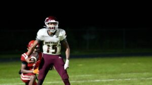 JJ Lewis celebrates a touchdown run against Crestview. The score would be called back after a referee determined Lewis had stepped out of bounds. Connor Matthews of Niceville would score the very next play.