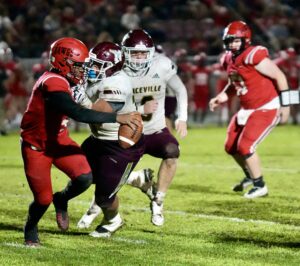 A Niceville defender wraps up Jazion McQueen for a sack. McQueen was forced to scramble much of the night as nice fills defensive line and linebackers pierced through Crestview pass protection.