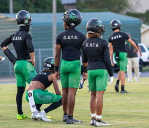 For Choctawhatchee Indians football players warm-up before their game against Niceville high school. The Indians would lose to the Eagles 42 to 25.