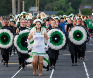 The Choctawhatchee style marches band, led by their drum major march to the field to commence the opening ceremonies before the football game between Choctawhatchee high school and Niceville high school.