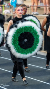 A colorguard member marches to the field for the beginning of the Niceville high school choctawhatchee high school football game.