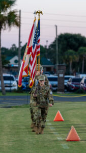 The Choctawhatchee high school junior ROTC marches the colors onto the field at Joe Etheridge stadium in Fort Walton Beach. The Choctaw Hatchie Indians would lose to the Niceville Eagles 42 to 25.