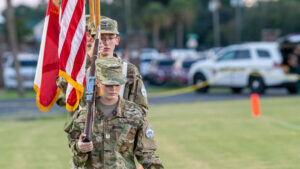 A cadet in the Choctawhatchee high school junior ROTC prepares to turn onto the field at Joe Etheridge Stadium in Fort Walton Beach to commence opening ceremonies for the game between Niceville high school and Choctawhatchee high school