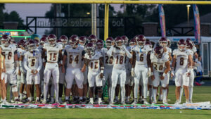 Niceville high school football players prepare to run through a handmade sign to commence the Niceville Eagles Choctawhatchee Indians football game on September 20