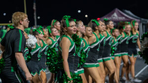 A Choctawhatchee High School Cheerleader addresses the camera as the team exhorts the team to victory. The Indians would score several times in the second quarter to make a game of the contest between the two teams. But, the Eagles would ultimately triumph 42-25.