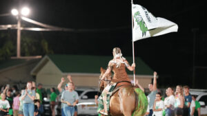 A member of the Choctawhatchee Sprit team moves her horse back to her starting point after the Indians scored a touchdown in the second quarter.