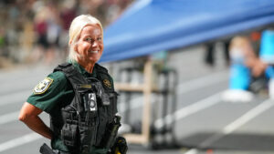 Niceville High School School Resource Officer (SRO) Melissa Vause poses for a photo at the end of the Niceville-Choctaw Football Game.