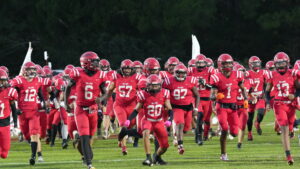 Lorenzo Blackwell (#20) leads the Crestview Bulldogs on the field for their matchup against the Niceville Eagles. The Eagles with prevail 35 to 14.