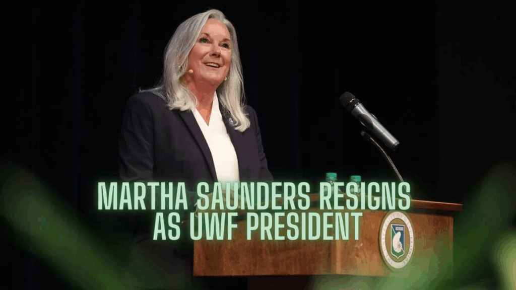 University of West Florida President Martha Saunders speaks at a podium during a public address, smiling as she delivers remarks.