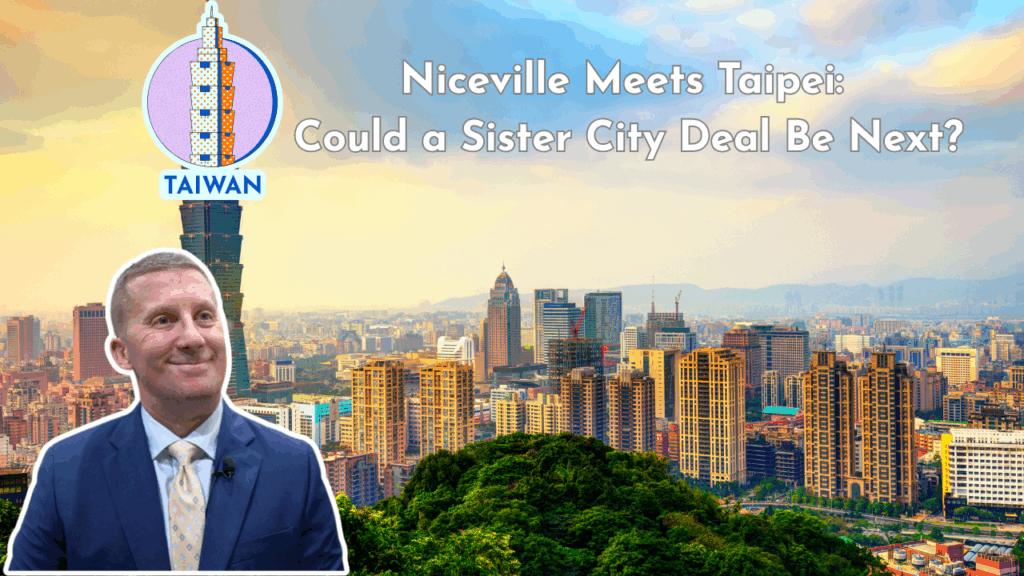 Niceville City Manager David Deitch in front of Taipei skyline with Taiwan graphic