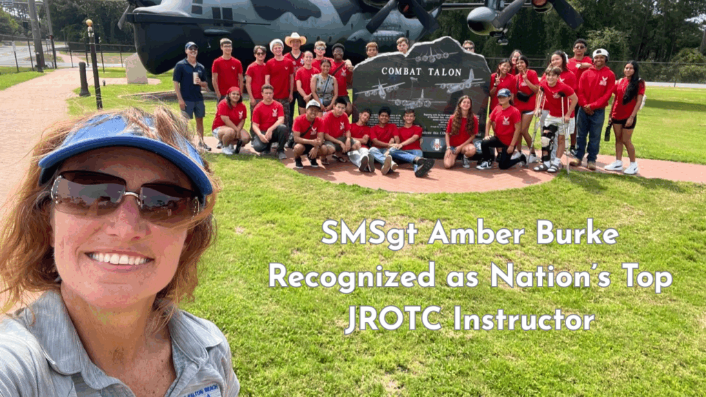 SMSgt Amber Burke takes a selfie with Fort Walton Beach High School AFJROTC cadets in front of the Combat Talon memorial aircraft.