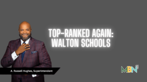 A smiling man in a plaid suit stands beside bold white text reading “Top-Ranked Again: Walton Schools,” with the MBN logo in the bottom corner.