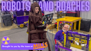 Video thumbnail: person in a brown robe uses a laptop beside a purple-yellow robotics rig, with a bold 'ROBOTS AND ROACHES' title across the top and Mills Heating & Air branding at the bottom.