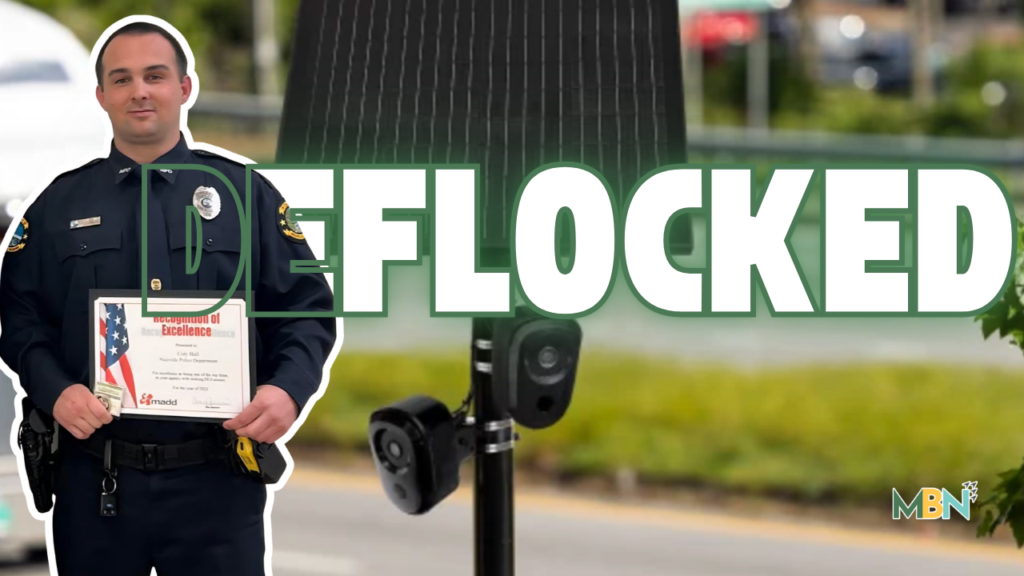 Police officer in uniform holding a certificate, standing beside a mounted speed camera with bold 'DEFLOCKED' overlay.