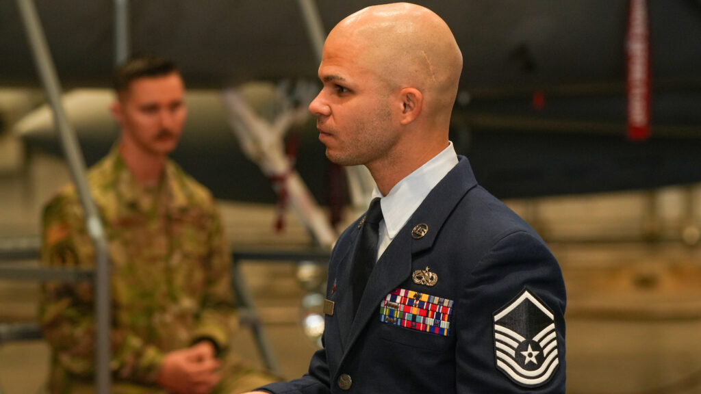 A senior enlisted airmen prepares for the change of command between outgoing General Mark Massaro and Colonel Terrance Chris Keithley