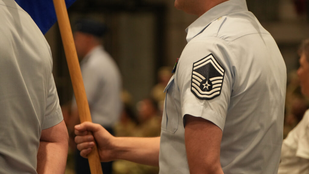 A senior master sergeant holds the guide on for his unit at the change of commands ceremony at the 96 testing on June 16, 2026.