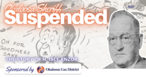 Banner announcing the Okaloosa sheriff’s suspension with a cartoon background, large 'Suspended' text, and a portrait on the right.