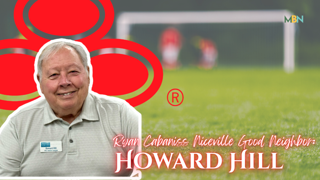 Smiling older man with a name badge, overlaid by red circular graphics on a blurred soccer field; caption reads 'Howard Hill'.